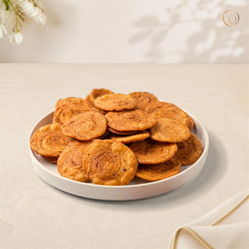 Pin Wheel Puri Masala on a white plate – Radhe Prem Ni Mithaas